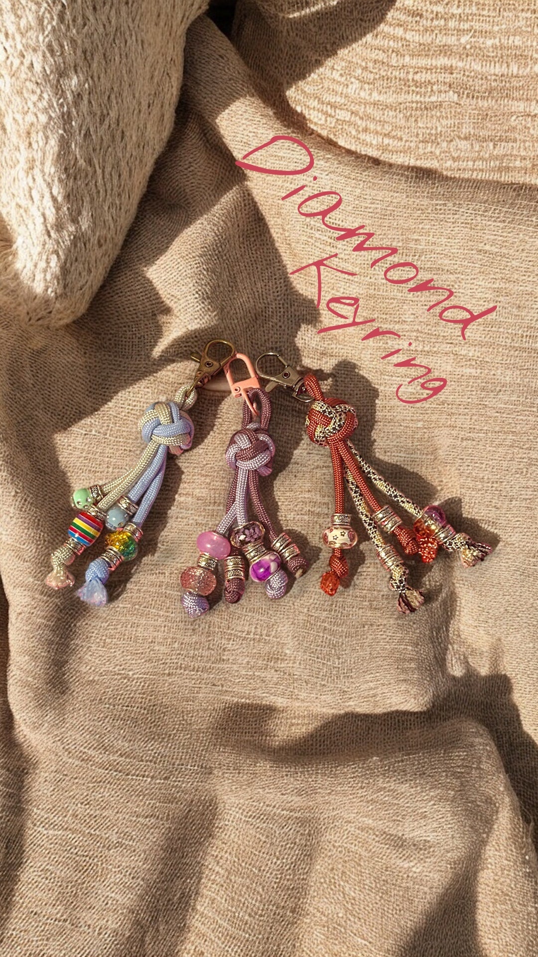 Three paracord keyring with beads on a linen background