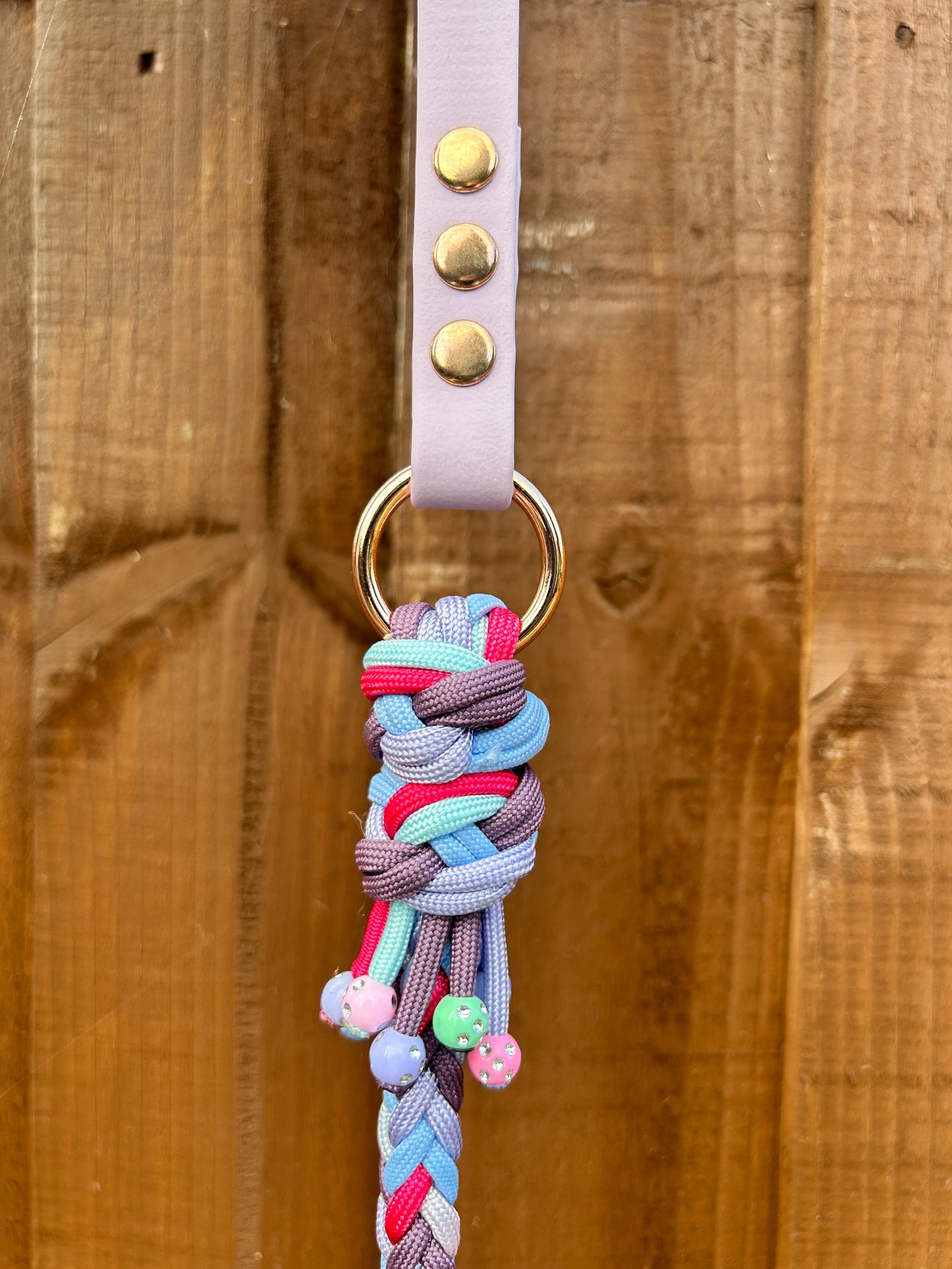 close up of paracord lead detail with decorative knot and beads