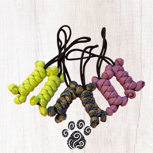 A set of multi coloured paracord zip pulls in the shape of a bone