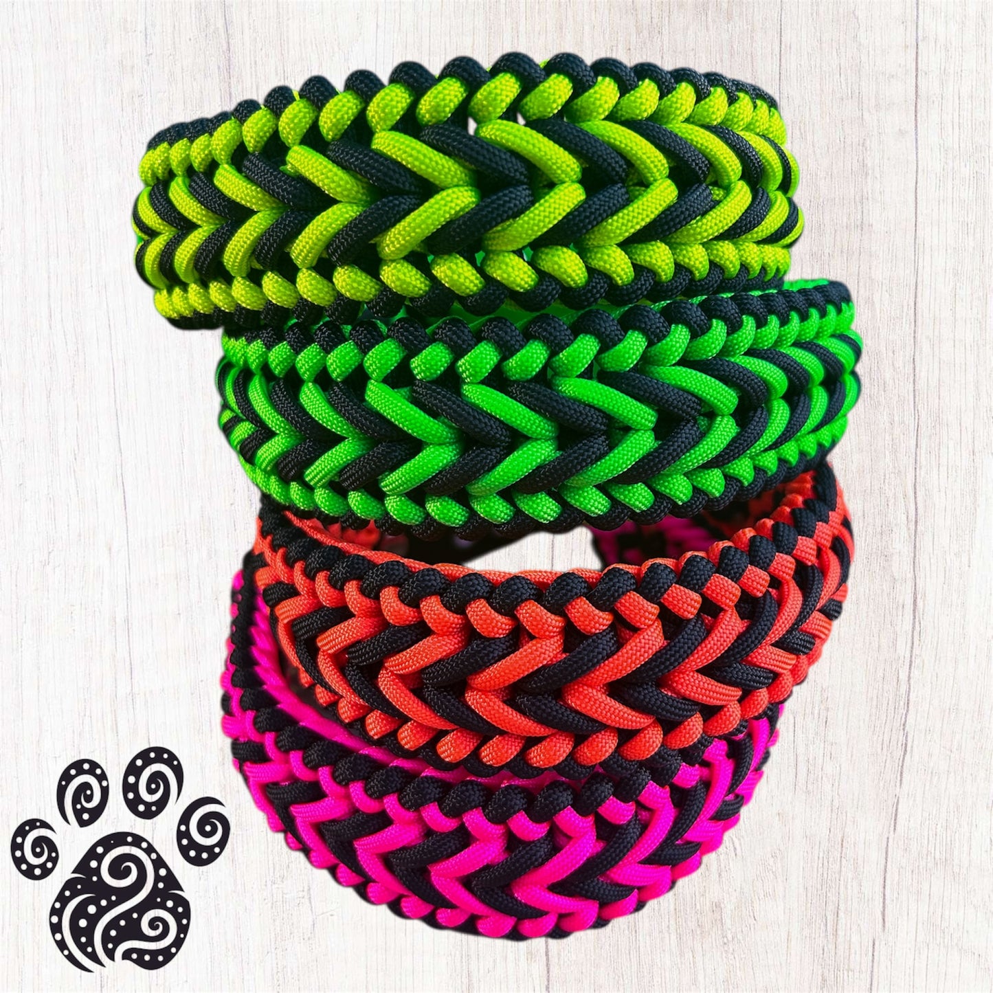 A stack of 4 paracord dog collars in black and neon
