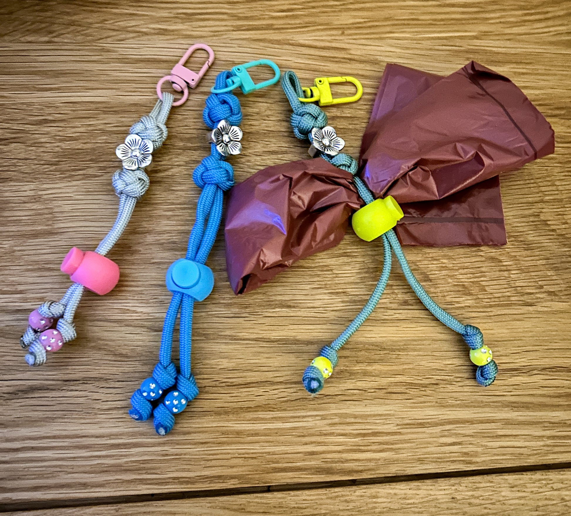 Colorful keychain with floral designs on a wooden surface