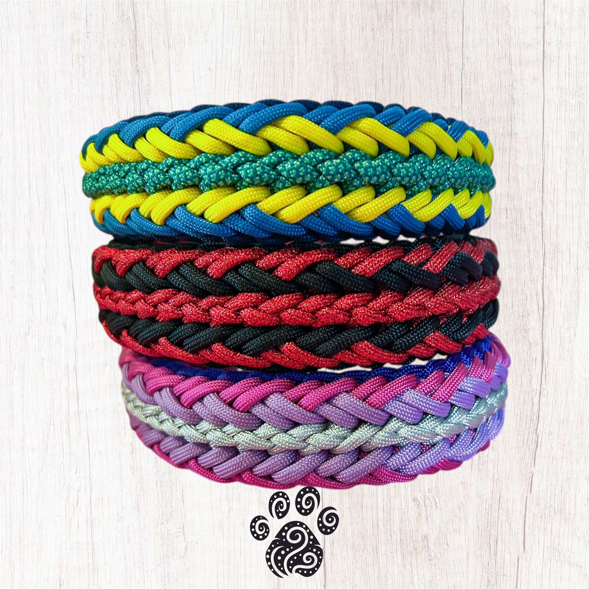 A stack of three paracord dog collars 