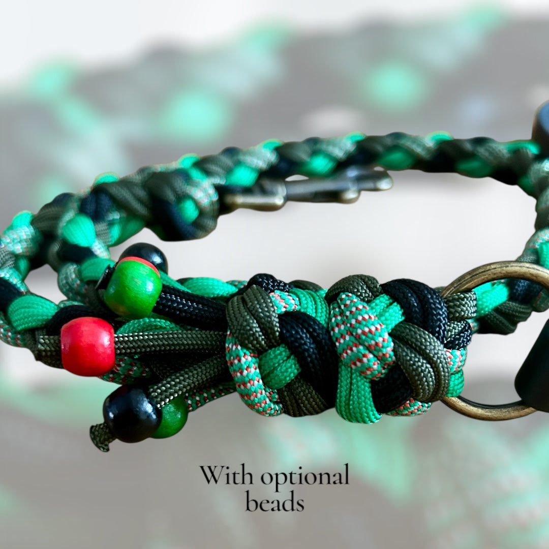 Green braided paracord lead with optional beads on a blurred background